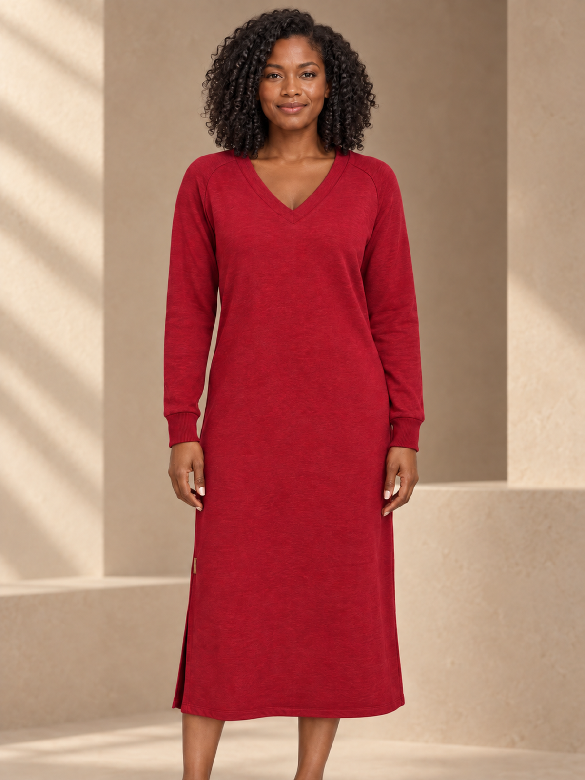 JXR3009 V-Neck Ribbed-Cuff Midi Dress on a female model in a warm taupe studio, head-to-mid-leg view