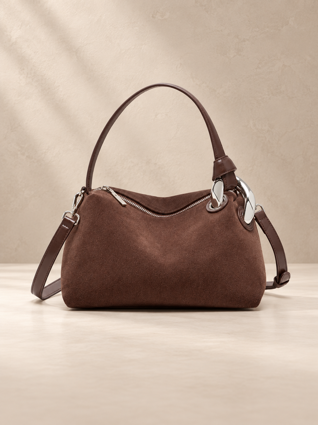 JXR4001 coffee brown suede-finish leather tote on a warm ivory-beige studio background