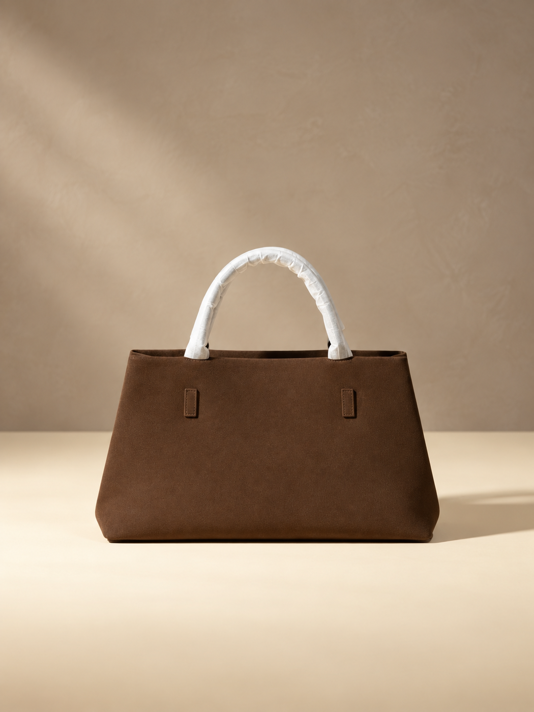 JXR4002 coffee faux-suede tote on a warm ivory-beige studio background