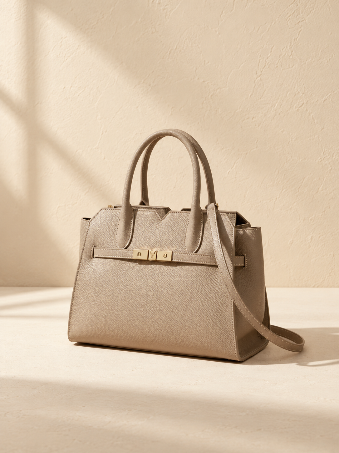 JXR4003 elephant-grey top-grain leather tote angled view on a warm ivory-beige studio background